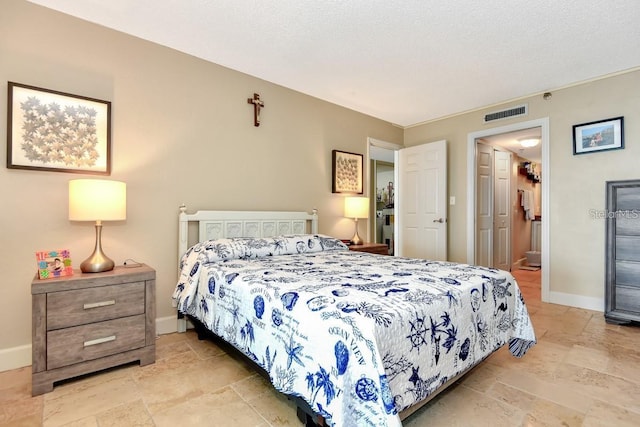 bedroom featuring a textured ceiling