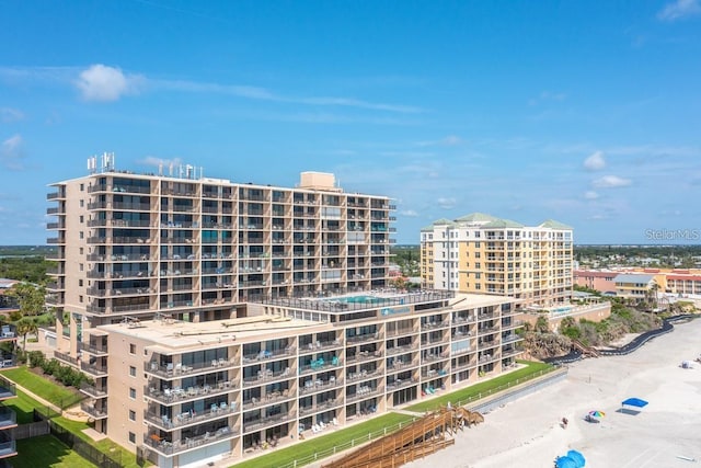 view of property featuring a beach view