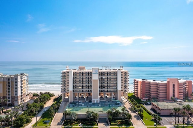 birds eye view of property featuring a view of the beach and a water view