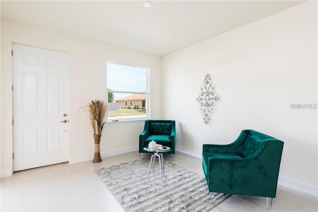 sitting room featuring tile patterned flooring