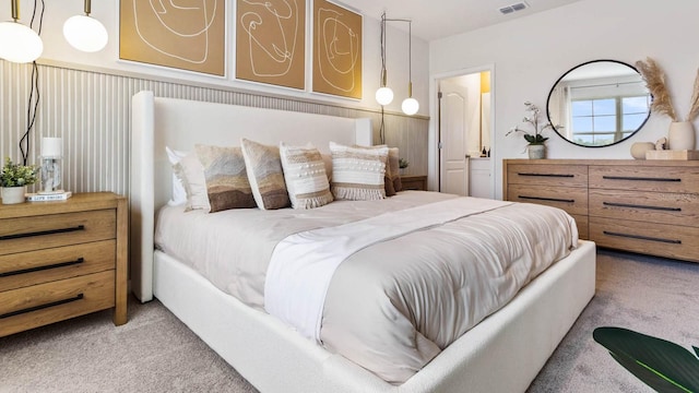 bedroom featuring light colored carpet