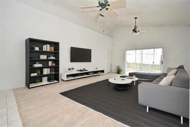 living room featuring ceiling fan and lofted ceiling