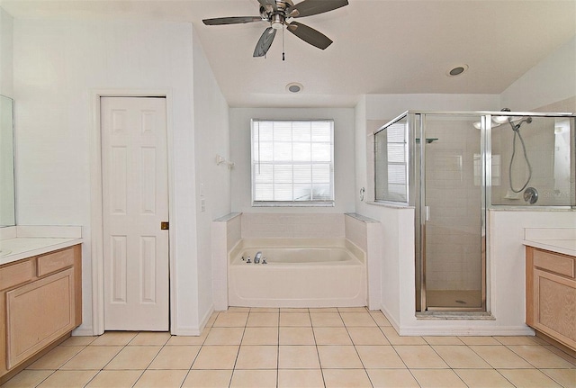 bathroom with ceiling fan, tile patterned flooring, vanity, and shower with separate bathtub