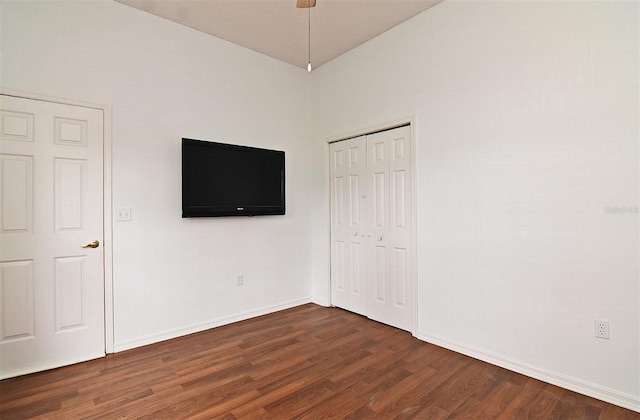 unfurnished bedroom featuring dark hardwood / wood-style flooring