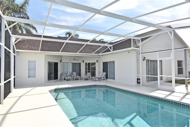 back of property featuring ceiling fan, a lanai, and a patio