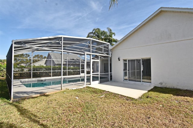 back of property featuring a yard, a patio area, and a lanai