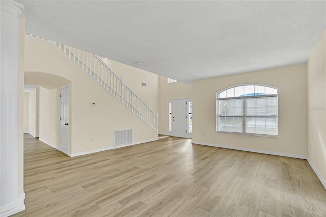 unfurnished living room with light hardwood / wood-style flooring