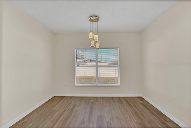 unfurnished dining area featuring hardwood / wood-style flooring