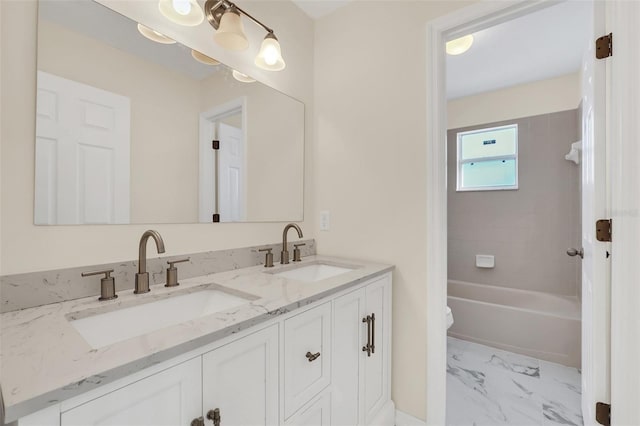 full bathroom with vanity, toilet, and tiled shower / bath combo