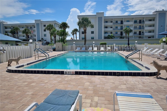 view of swimming pool featuring a patio area