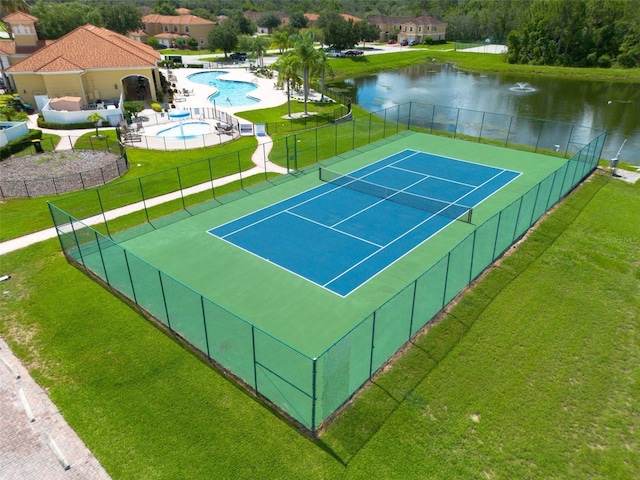 view of sport court featuring a yard, fence, and a community pool