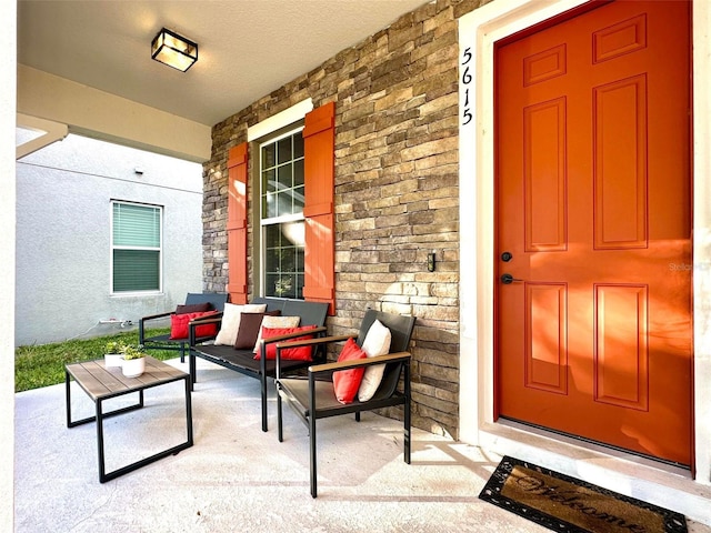 entrance to property featuring covered porch