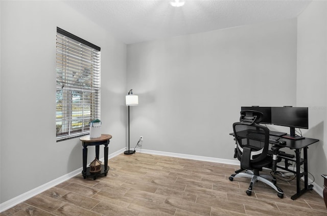 office space with a textured ceiling