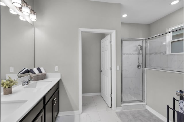 bathroom featuring vanity and an enclosed shower