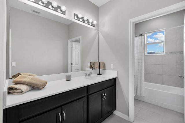 bathroom featuring tile patterned floors, shower / bath combo, and vanity