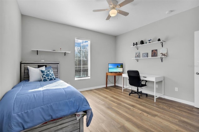 bedroom featuring ceiling fan and hardwood / wood-style floors