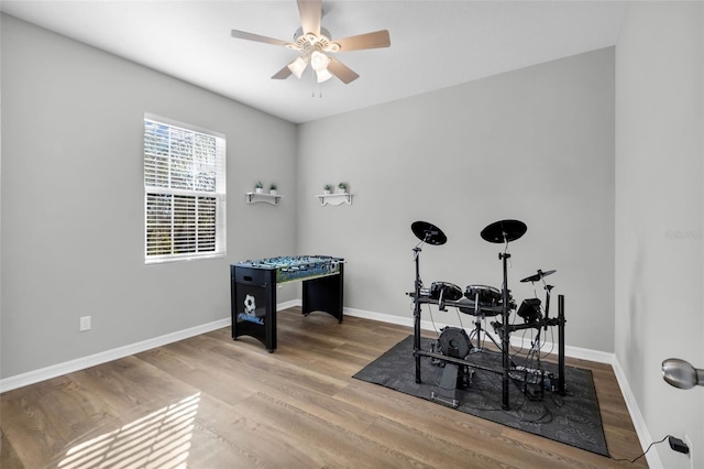 game room featuring hardwood / wood-style flooring and ceiling fan