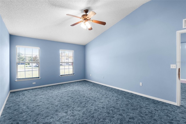 carpeted empty room featuring a textured ceiling, ceiling fan, and lofted ceiling