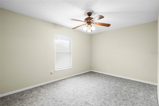 empty room featuring carpet flooring, a textured ceiling, and ceiling fan