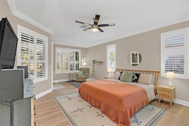 bedroom featuring radiator, hardwood / wood-style flooring, ceiling fan, and crown molding