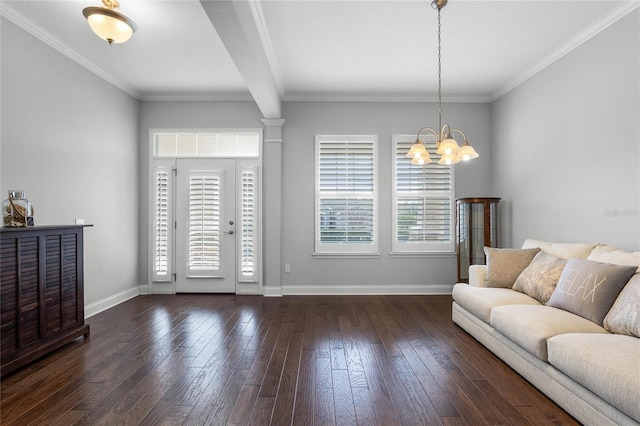 living room featuring ornamental molding, an inviting chandelier, and a healthy amount of sunlight