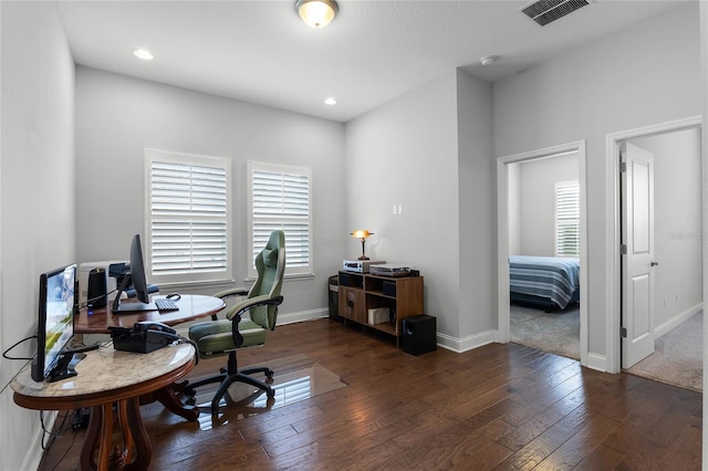 office space with dark hardwood / wood-style flooring