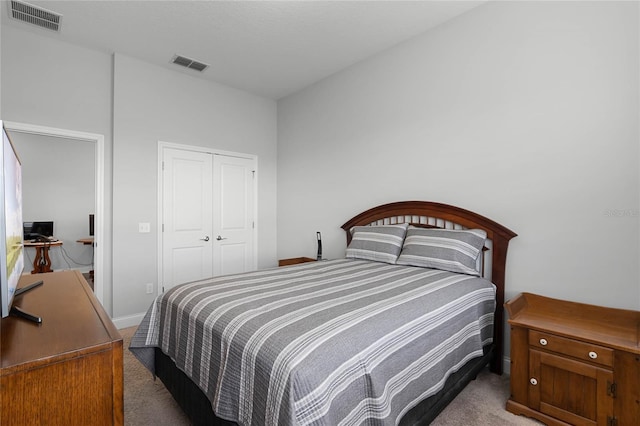 bedroom with light colored carpet and a closet