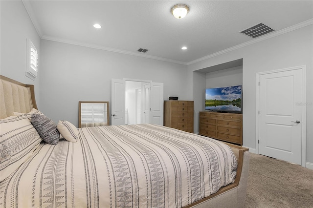 carpeted bedroom with ornamental molding and a textured ceiling