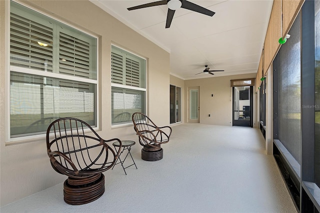 sunroom with ceiling fan