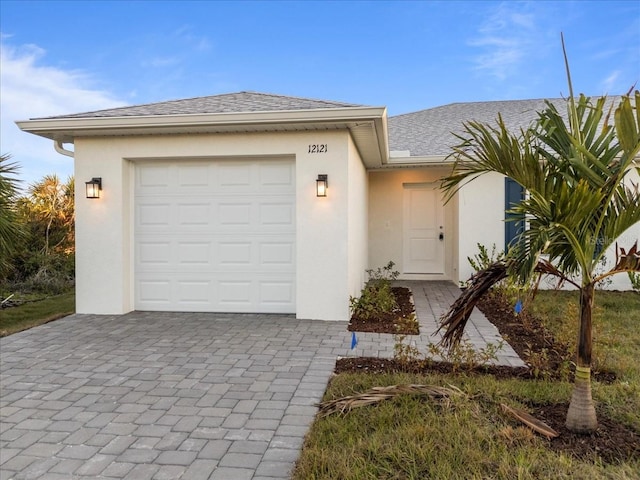 view of front of home with a garage