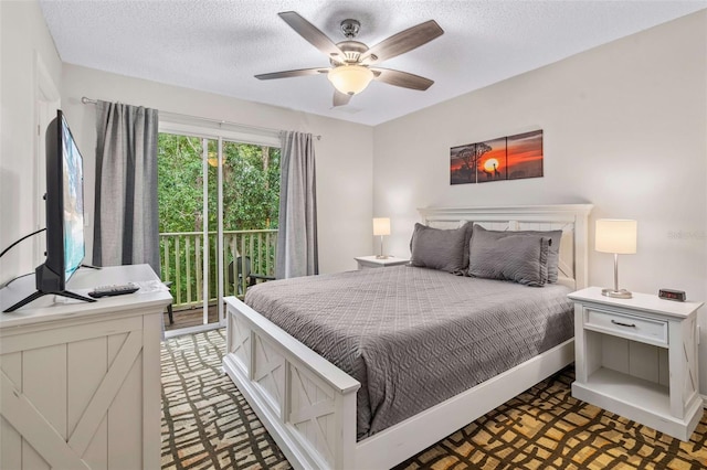 bedroom with access to exterior, ceiling fan, and a textured ceiling