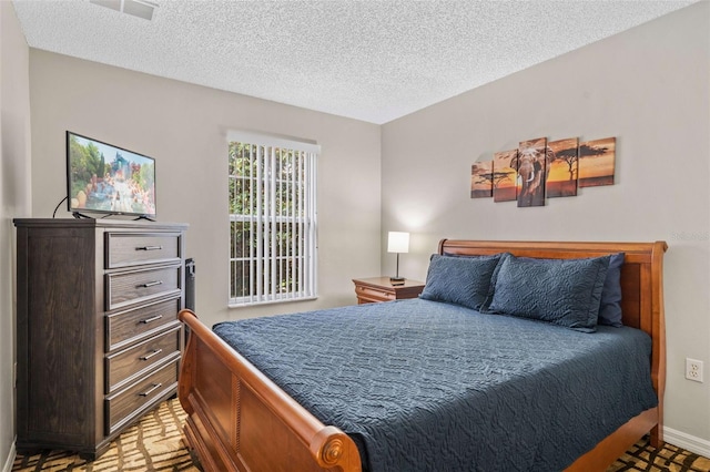 bedroom featuring a textured ceiling