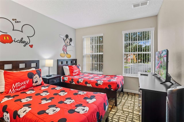 bedroom featuring a textured ceiling