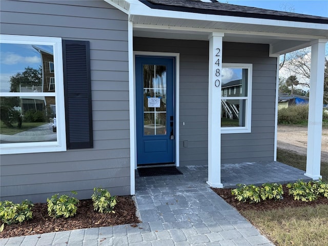 doorway to property featuring a porch