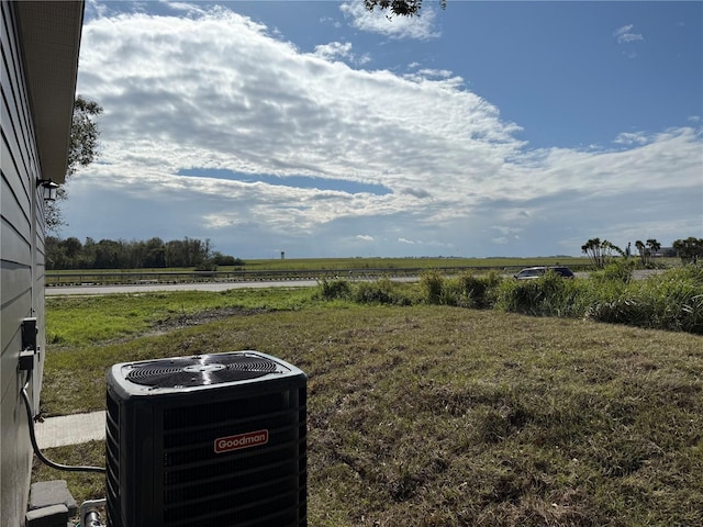 view of yard with a rural view and cooling unit