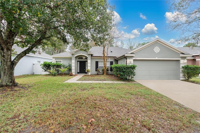 single story home featuring a garage and a front lawn