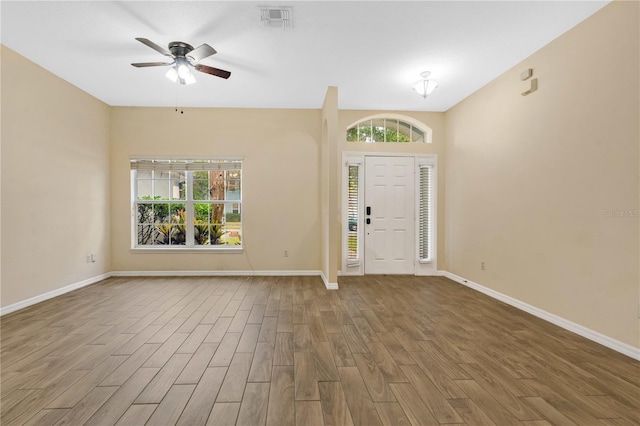 foyer entrance featuring hardwood / wood-style floors and ceiling fan