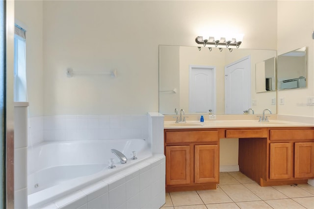 bathroom with vanity, tile patterned floors, and tiled tub