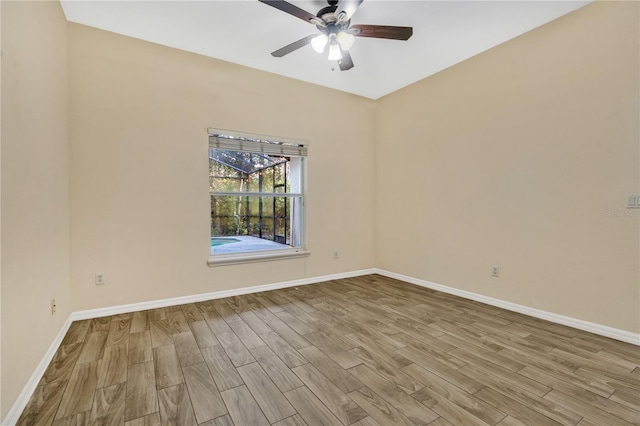 unfurnished room with ceiling fan and light wood-type flooring