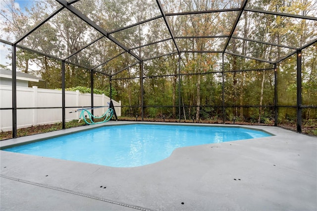 view of pool with a lanai and a patio area