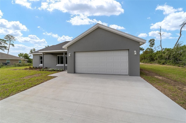 view of front of house featuring a front yard and a garage