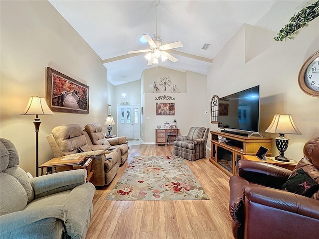 living room with high vaulted ceiling, light hardwood / wood-style flooring, and ceiling fan