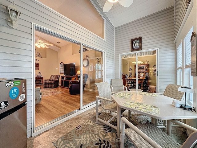 sunroom featuring ceiling fan and lofted ceiling