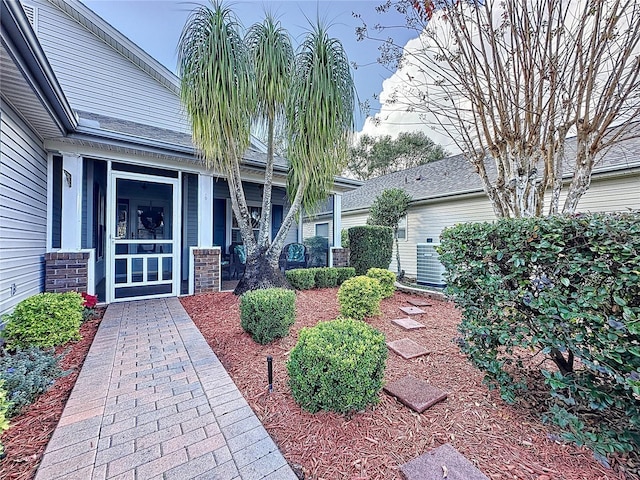 doorway to property featuring central AC