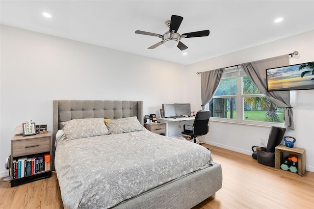 bedroom featuring light hardwood / wood-style floors and ceiling fan