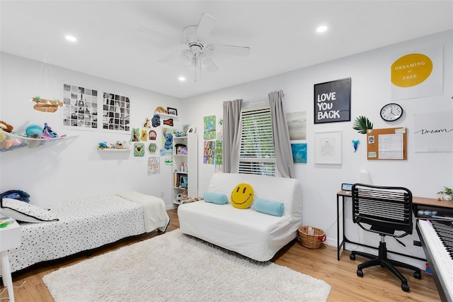 bedroom featuring ceiling fan and wood-type flooring