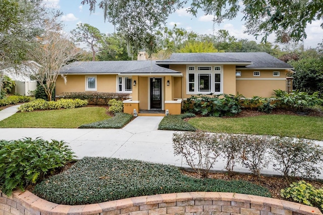 view of front of house with a front lawn