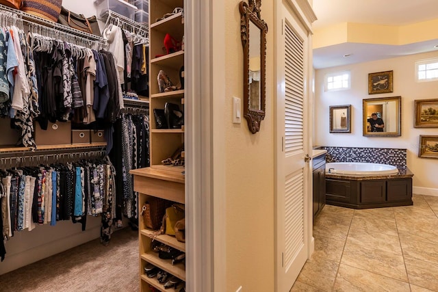 spacious closet featuring light tile patterned flooring