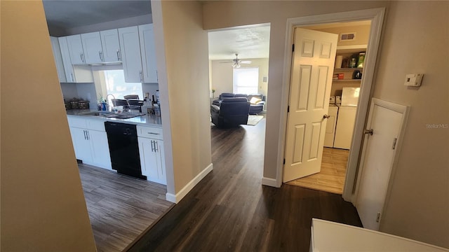 kitchen featuring ceiling fan, sink, white cabinets, black dishwasher, and dark hardwood / wood-style floors