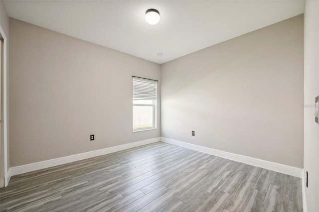 unfurnished room featuring light hardwood / wood-style flooring